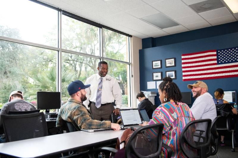 Veteran students learning inside the Defenders Den on campus.